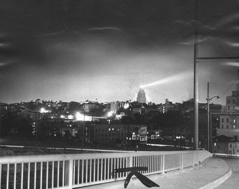 From the Herald-Examiner, May 7, 1952. "Atomic blast gives Los Angeles an early 'sunrise'. It was still dark in Los Angeles at 5:15 a.m. today when the "early dawn" momentarily shone on the northeast horizon. The flash came from the latest atomic explosion in Nevada. The photo above was taken from the top of the hill at Sixth and St. Paul Streets. City Hall and its beacon show it clearly."