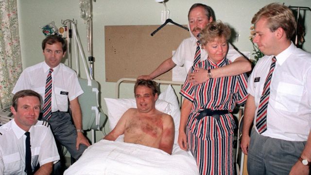 How did Tim Lancaster, the pilot who was sucked out of an airplane's windshield, survive?